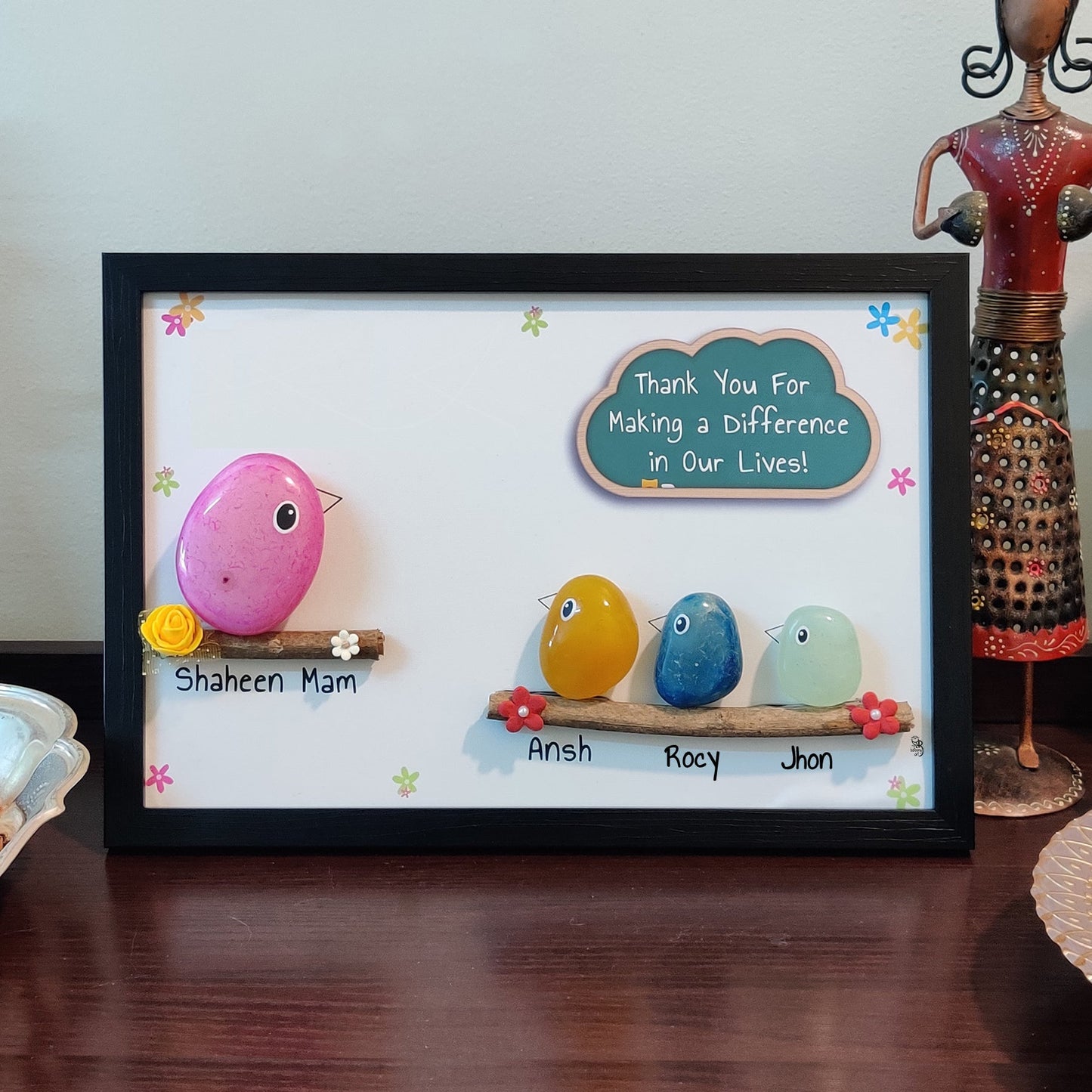 Elegant hand-painted pebble art – perfect for personalized gifting and home styling.