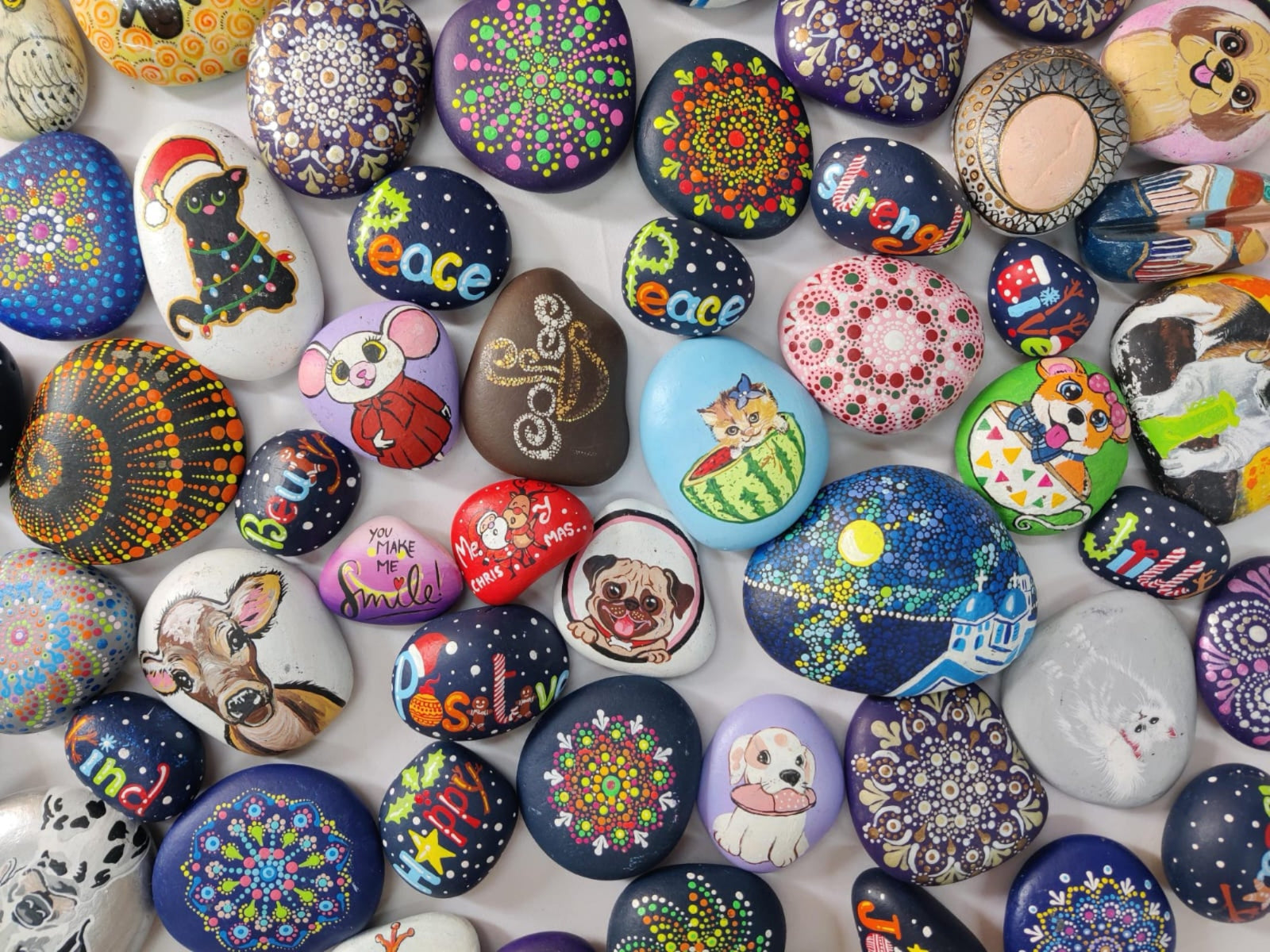 Personalized hand-painted rock art – a stunning addition to your home or office.