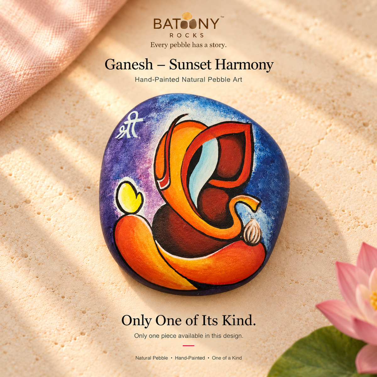 Ganesh: Sunset Harmony hand-painted natural pebble art, on a warm stone surface