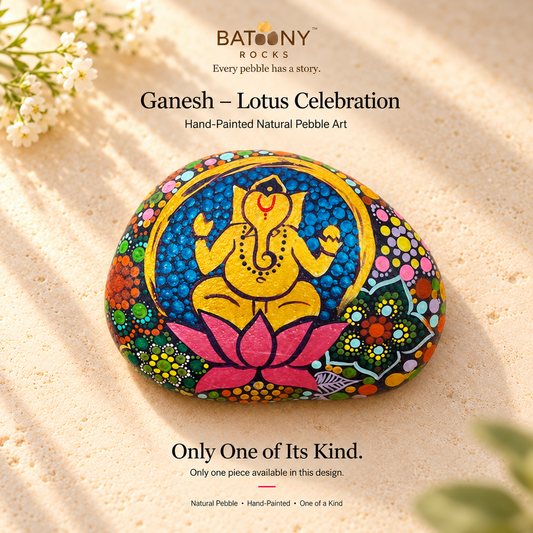 Ganesh: Lotus Celebration hand-painted natural pebble art, on a warm stone surface