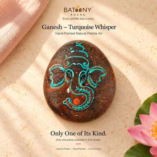 Ganesh: Turquoise Whisper hand-painted natural pebble art, on a warm stone surface