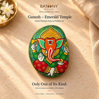 Ganesh: Emerald Temple hand-painted natural pebble art, on a warm stone surface