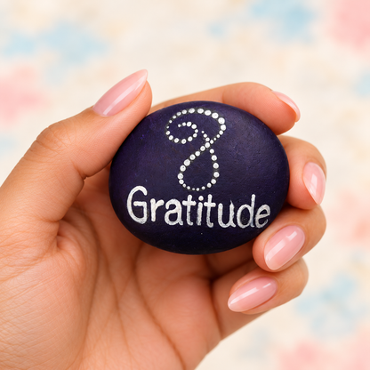 Gratitude: Blossom Mandala: selected hand-painted pebble held in hand