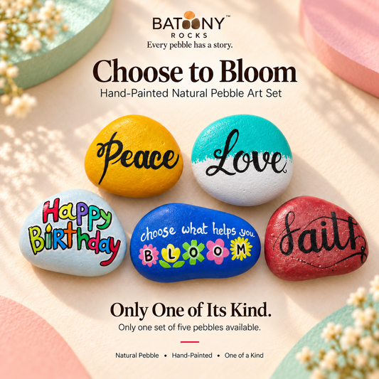 Choose to Bloom: hand-painted pebble art displayed as a complete product
