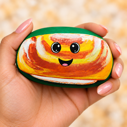 Idli, Dosa, Sambar, Chutney: selected hand-painted pebble held in hand