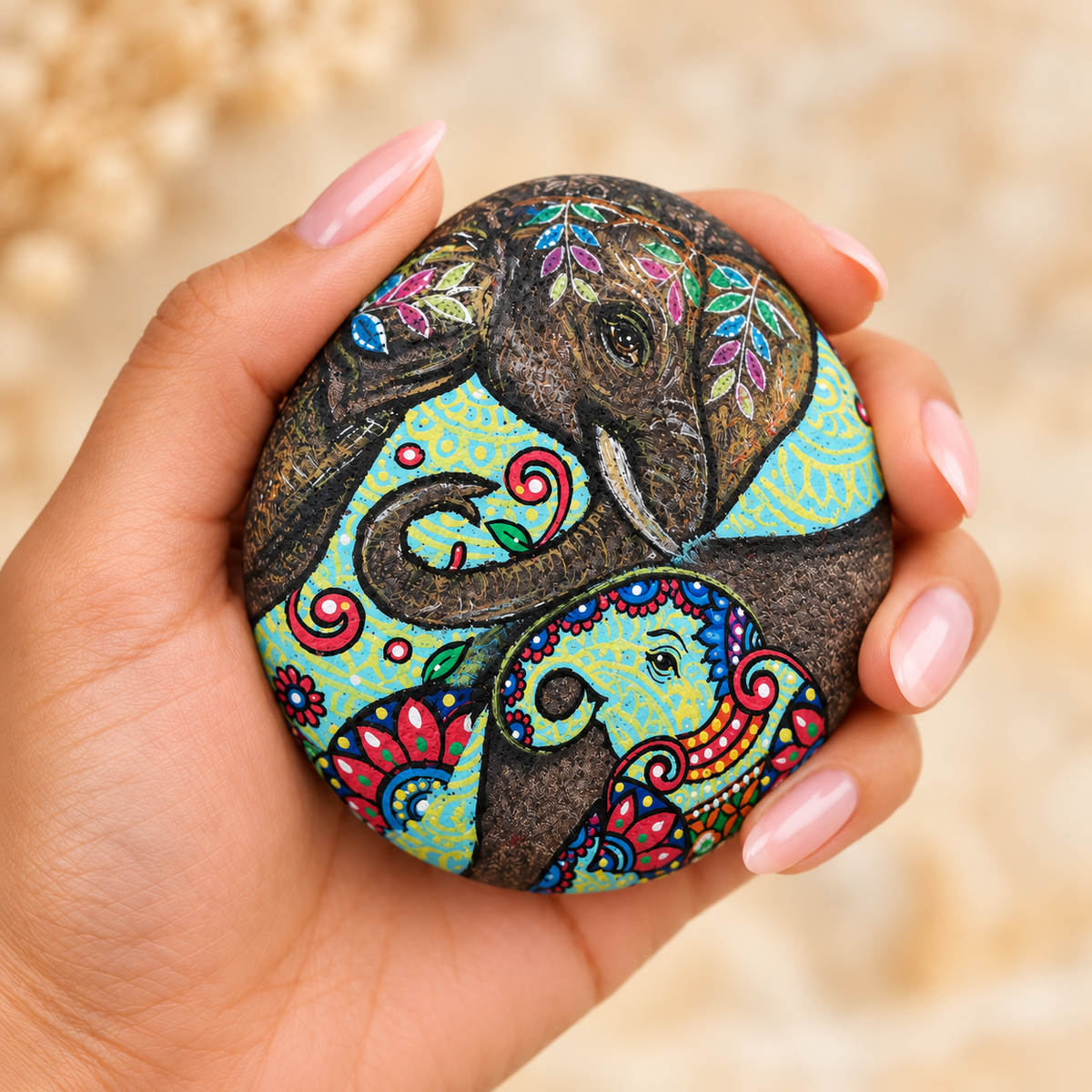 Elephant and Kamdhenu: Folk Blessings: selected hand-painted pebble held in hand