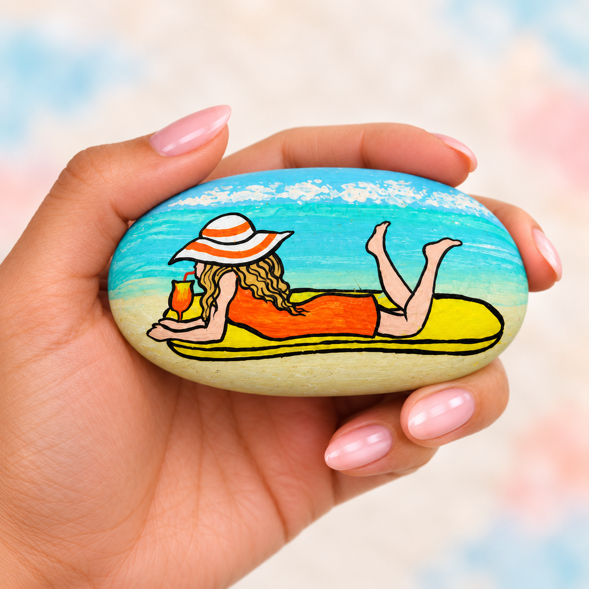 Beach Days: One in a Million: selected hand-painted pebble held in hand