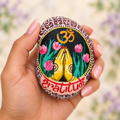 Gratitude: Sacred Spiral: selected hand-painted pebble held in hand