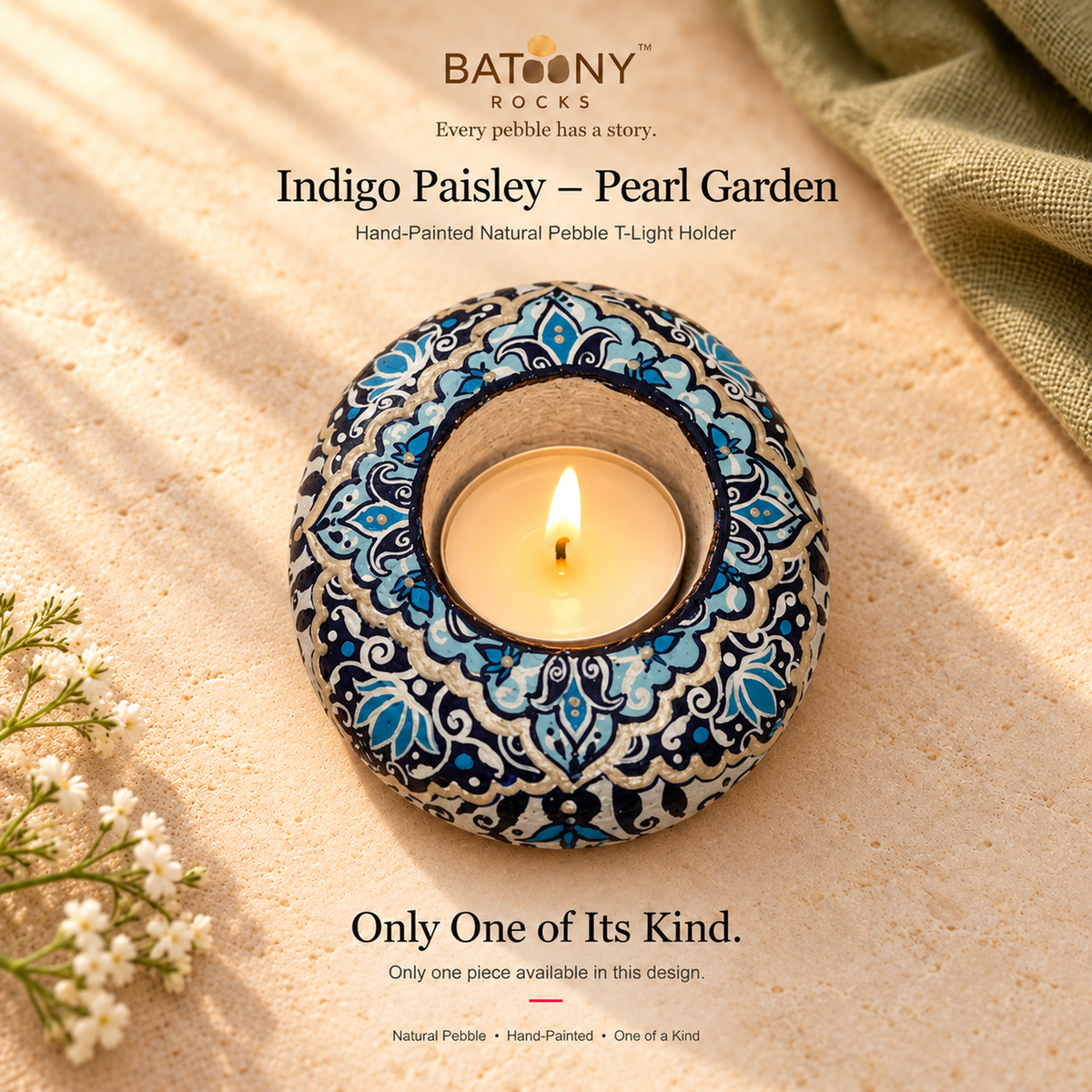 Indigo Paisley: Pearl Garden hand-painted natural pebble tealight holder, on a warm stone surface