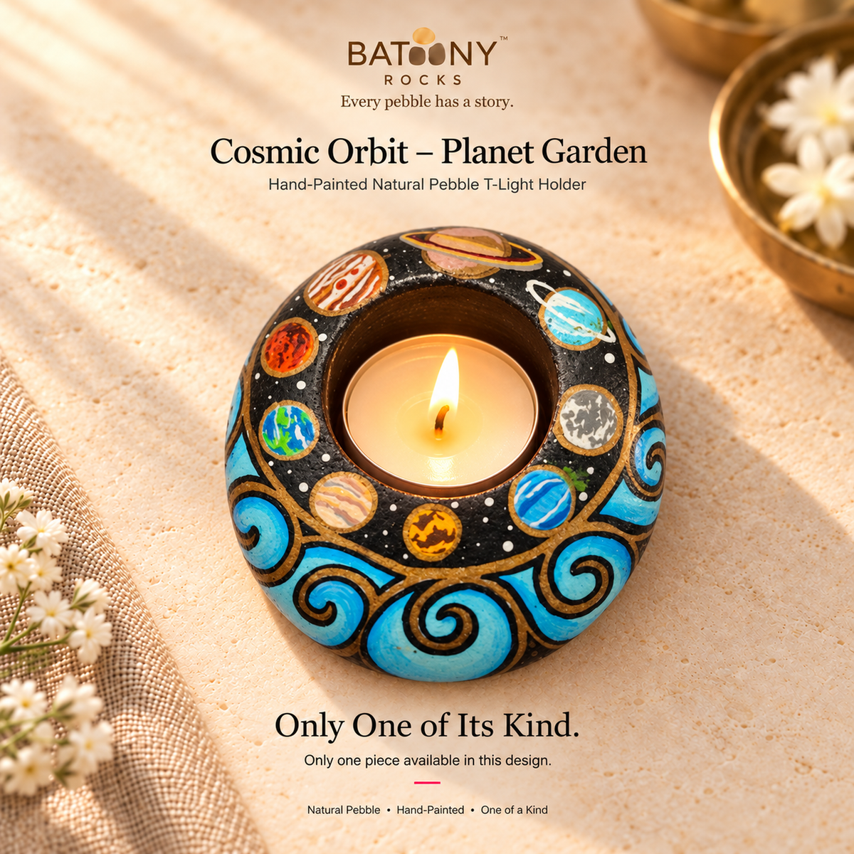 Cosmic Orbit: Planet Garden hand-painted natural pebble tealight holder, on a warm stone surface