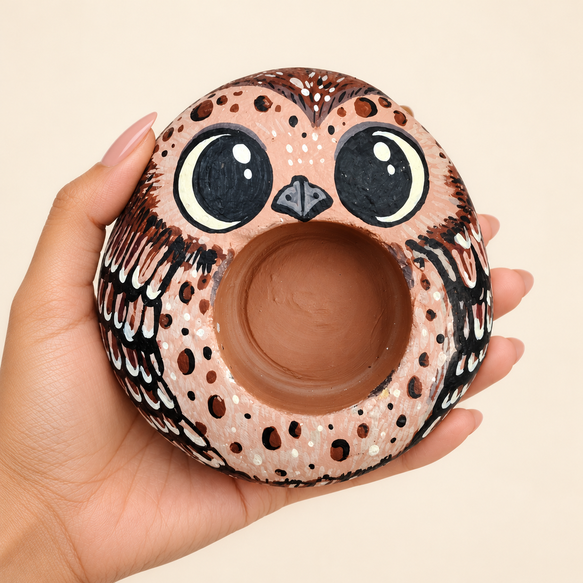 Wide-Eyed Owl: Woodland Wonder hand-painted natural pebble tealight holder, shown in hand for scale