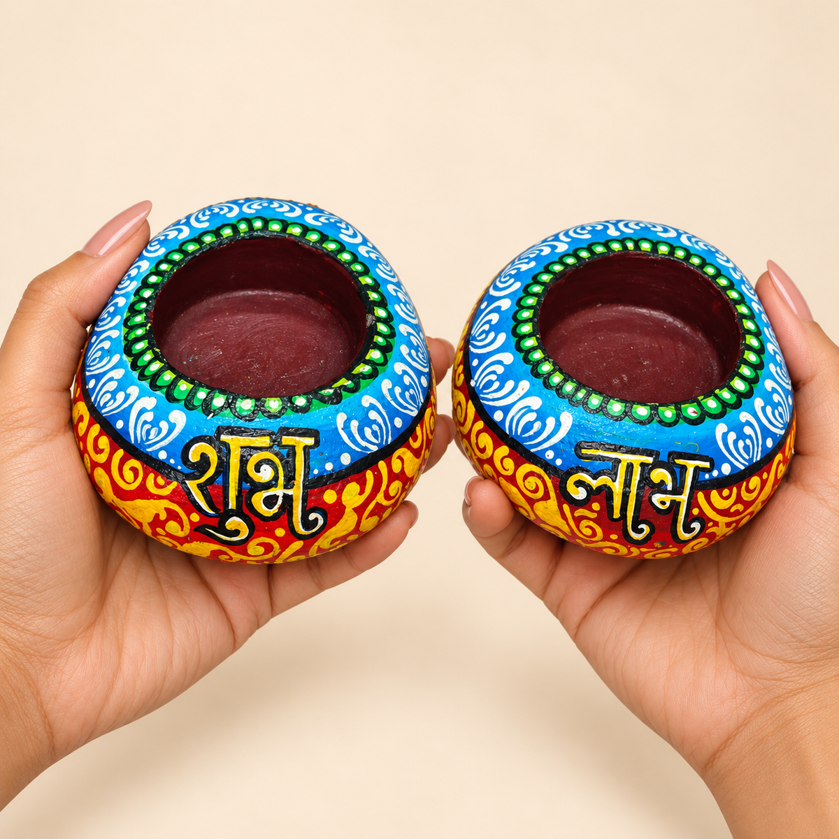 Shubh Labh: Sky Blue Harmony hand-painted natural pebble tealight holder, shown in hand for scale