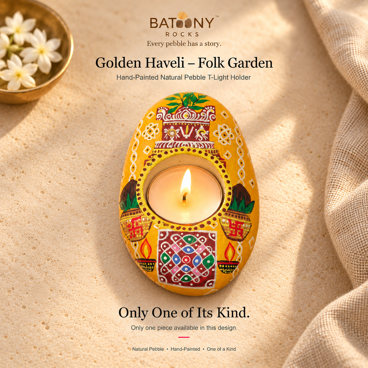 Golden Haveli: Folk Garden hand-painted natural pebble tealight holder, on a warm stone surface