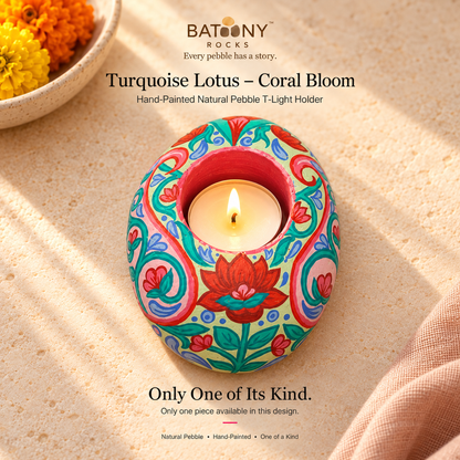 Turquoise Lotus: Coral Bloom hand-painted natural pebble tealight holder, on a warm stone surface
