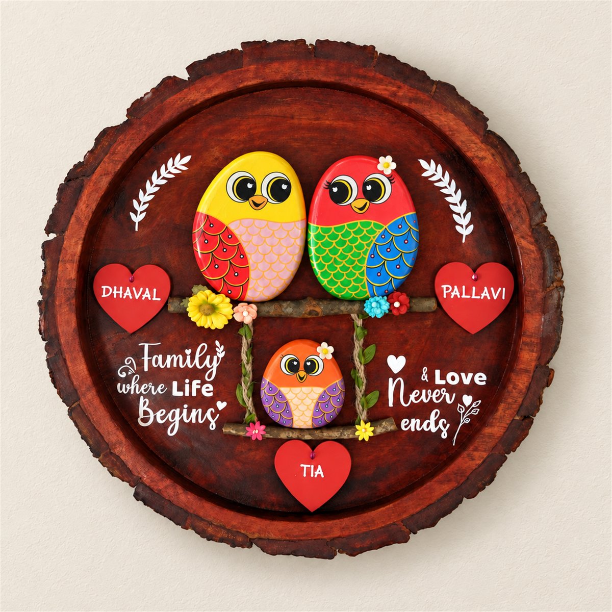 Blissful Bond Trio Pebble Art: two birds above a smaller bird on a swing with red heart name tags, on a beige background