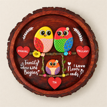 Blissful Bond Trio Pebble Art: two birds above a smaller bird on a swing with red heart name tags, on a beige background