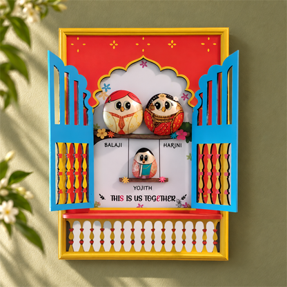 Jharokha Family of 3: three birds in traditional dress inside a red, blue and gold jharokha, in a home setting