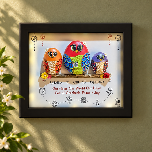 Mom and Us - Personalised Decorative Nameplate: three colourful birds on a branch with small hobby illustrations, black frame, in a home setting