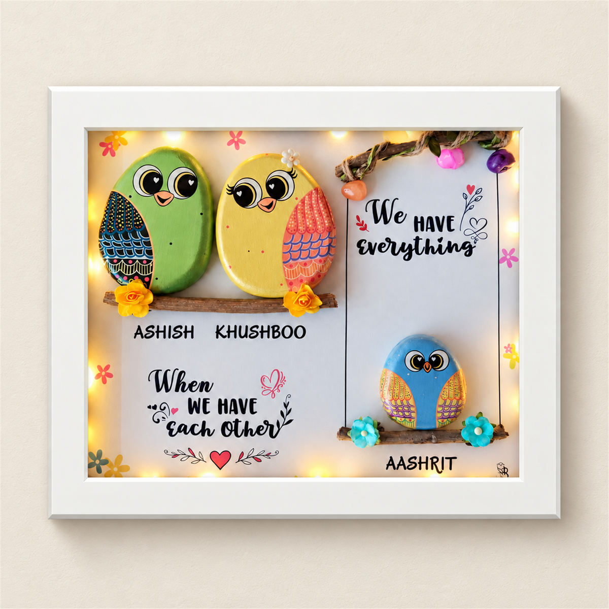 Sweet & Nutty Bond Pebble Art: three little birds on two branches with a family message, white frame, on a beige background