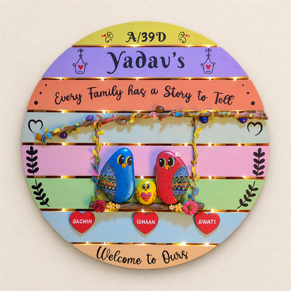 Treasured Narratives Nameboard: family birds on a round pastel nameboard, on a beige background
