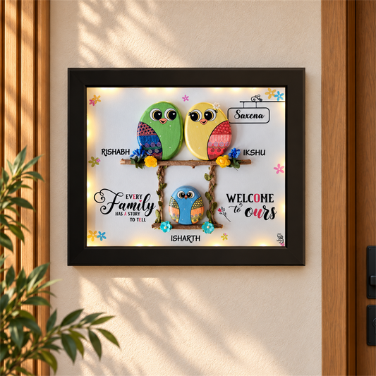 Trio Love Forever: three colourful birds in a family-themed frame, black frame, in a home setting